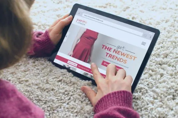 4 Things Your Small Business Website Design Needs - online shopping with a digital tablet computer from home picture id684931302